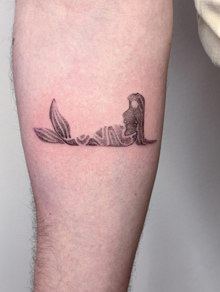 Image from tattoo gallery of odds tattoo, mermaid in whip shading and dot work 